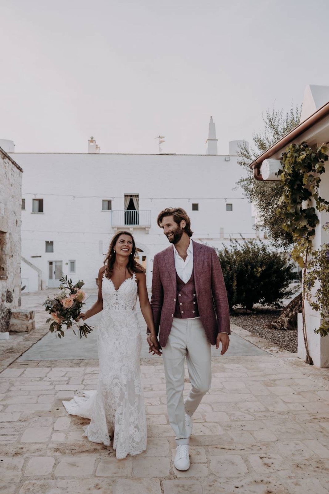 Burgundy wedding suit with matching wedding dress